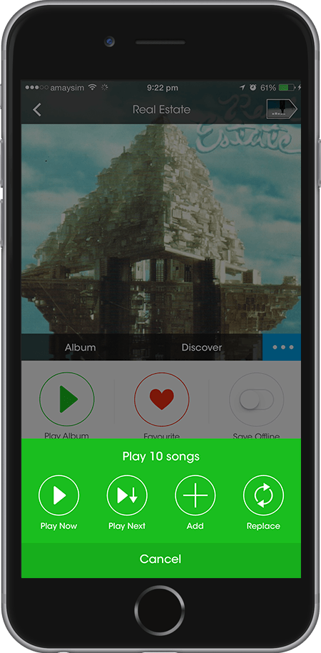 An album screen for Real Estate with the green 'play 10 songs' sheet open across the lower half